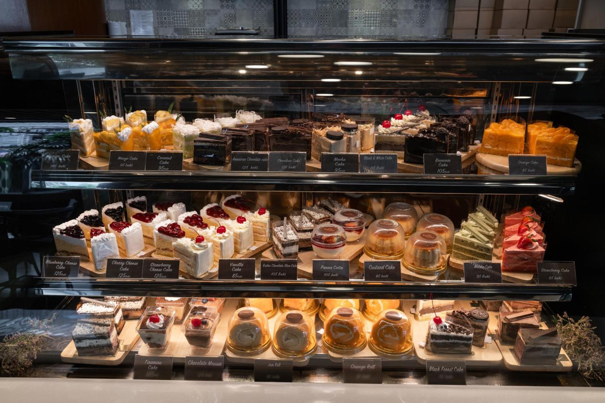 Royal Phuket City Hotel Bagian luar foto A display case of pastries