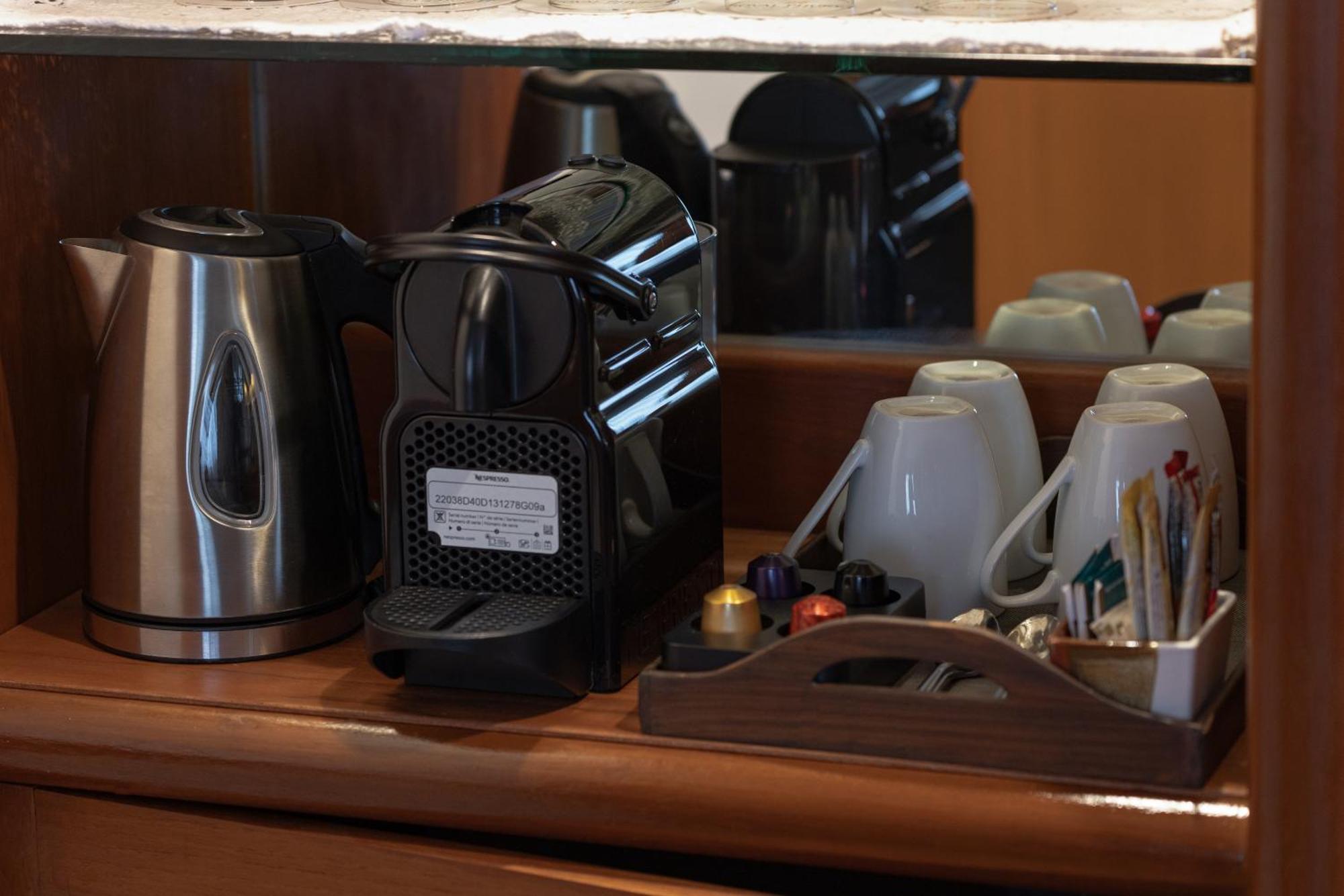 Royal Phuket City Hotel Bagian luar foto A Nespresso coffee machine in a hotel room